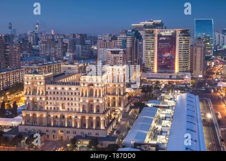 Azerbaijan, Baku, high angle skyline with Dom Soviet Government House, dusk Stock Photo