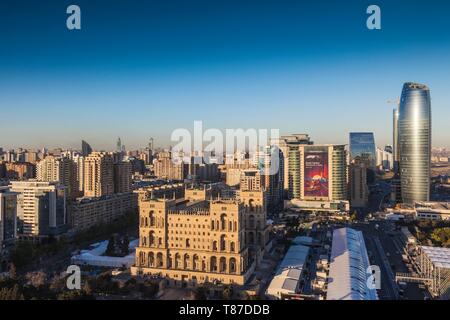 Azerbaijan, Baku, high angle skyline with Dom Soviet Government House, dusk Stock Photo