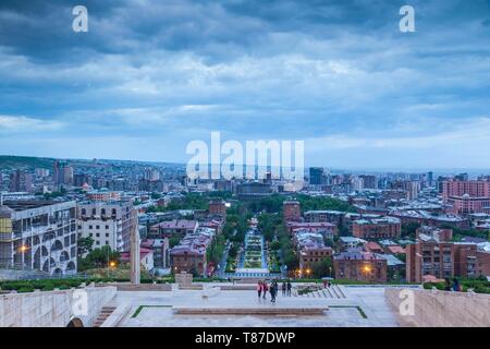 Armenia, Yerevan, The Cascade, high angle view of city skyline, dusk, with visitors Stock Photo