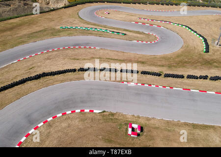 Curves on karting race track, aerial view background. Stock Photo