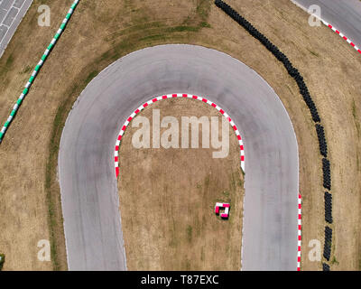 Curves on karting race track, aerial view background. Stock Photo