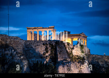 ATHENS, Greece - The Acropolis of Athens is an ancient citadel standing on a rocky outcrop above Athens, Greece. It is one of the most famous archeological sites in the world and is a UNESCO World Heritage site. It consists of a number of structures on the top of the hill, along with other sites on the surrounding hillside. The most famous structure if the Parthenon, a large temple dating back to the 5th century BC and featuring a distinctive outer layer of large columns. Stock Photo