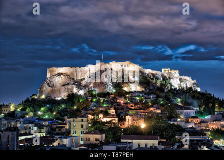 ATHENS, Greece - The Acropolis of Athens is an ancient citadel standing on a rocky outcrop above Athens, Greece. It is one of the most famous archeological sites in the world and is a UNESCO World Heritage site. It consists of a number of structures on the top of the hill, along with other sites on the surrounding hillside. The most famous structure if the Parthenon, a large temple dating back to the 5th century BC and featuring a distinctive outer layer of large columns. Stock Photo