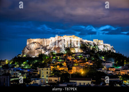 ATHENS, Greece - The Acropolis of Athens is an ancient citadel standing on a rocky outcrop above Athens, Greece. It is one of the most famous archeological sites in the world and is a UNESCO World Heritage site. It consists of a number of structures on the top of the hill, along with other sites on the surrounding hillside. The most famous structure if the Parthenon, a large temple dating back to the 5th century BC and featuring a distinctive outer layer of large columns. Stock Photo