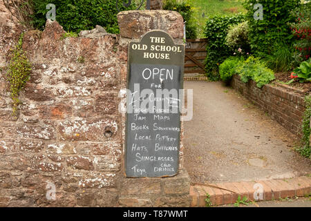Items for sale on blackboard outside traditional village tourist shop, Cockington,Devon,England,UK Stock Photo