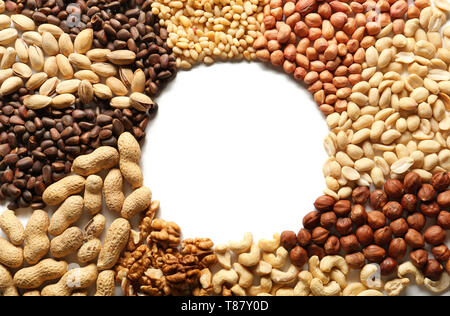 Frame made of different nuts on white background Stock Photo