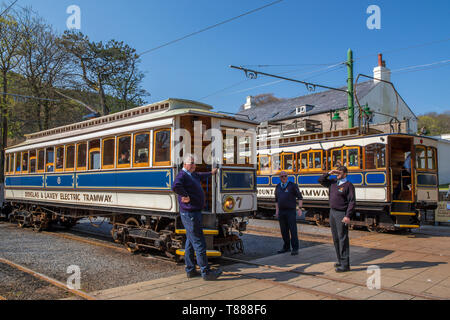 Douglas and Laxey Electric Tramway carriage alongside Snaefell Mountain Railway train in Laxey, Isle of Man Stock Photo