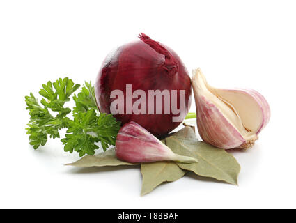 Garlic and onion with parsley and bay leaves on white background Stock Photo