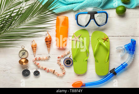 Composition with beach items on wooden background Stock Photo
