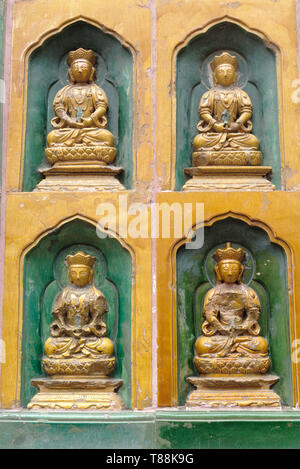 Close-up on Buddhas on the wall of the temple on top of Longevity Hill at Summer Palace in Beijing, China Stock Photo