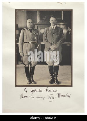 Benito Mussolini (1883 - 1945) - Friedrich-Karl Florian, signed photograph The picture shows Hitler and Mussolini, beneath, the ink dedication 'A Gauleiter Florian Roma 20 marzo XVII - Mussolini'. 25 x 34 cm. historic, historical, 20th century, 1930s, NS, National Socialism, Nazism, Third Reich, German Reich, Germany, German, National Socialist, Nazi, Nazi period, fascism, Editorial-Use-Only Stock Photo