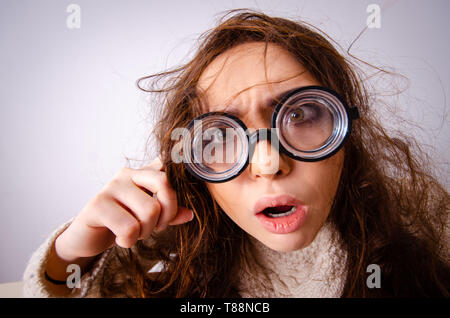 Funny nerd girl working on computer Stock Photo