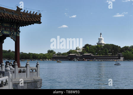 Scenery at lake with White Pagoda on hill at Beihai Park, Beijing, China Stock Photo