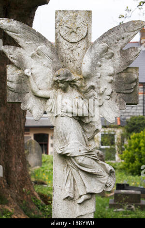winged angel on a cross. Stock Photo