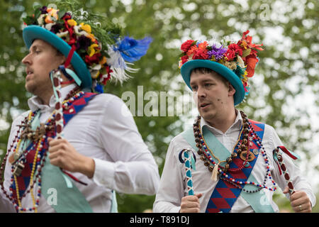 London, UK. 11th May 2019. Westminster Day of Dance in Victoria Tower Gardens. Morris dancers from Earlsdon Morris Coventry perform a merry bells and batons traditional North West clog dance - which has its origins in the 19th century industrial towns of Lancashire and north Cheshire. Credit: Guy Corbishley/Alamy Live News Stock Photo