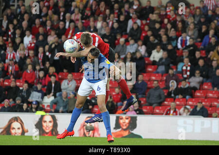 Sunderland, UK. 11th May 2019. Jimmy Dunne of Sunderland contests a header with Christian Burgess of Portsmouth during the Sky Bet League 1 Play off Semi Final 1st Leg match between Sunderland and Portsmouth at the Stadium Of Light, Sunderland on Saturday 11th May 2019. (Credit: Mark Fletcher | MI News) Stock Photo