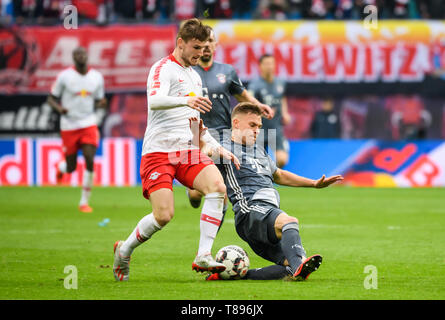 Leipzig, Germany. 11th May, 2019. Bayern Munich's Joshua Kimmich (R, front) vies with Leipzig's Timo Werner (L, front) during a German Bundesliga match between RB Leipzig and FC Bayern Munich in Leipzig, Germany, on May 11, 2019. The match ended 0-0. Credit: Kevin Voigt/Xinhua/Alamy Live News Stock Photo