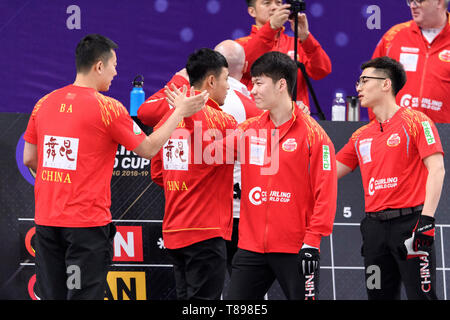 Beijing, China. 12th May, 2019. Team China celebrate ahead of the 2018-2019 WCF Curling World Cup Grand Final men's final between China and Canada 2 at the Shougang Ice Hockey Arena in Beijing, capital of China, May 12, 2019. China lost 3-5 and won the silver. Credit: Chen Yichen/Xinhua/Alamy Live News Stock Photo