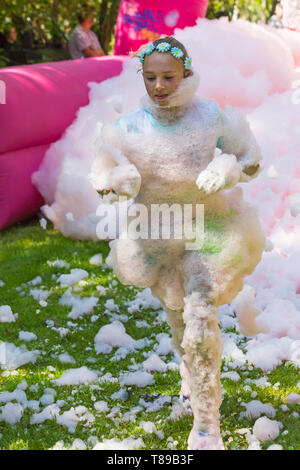 Weymouth, Dorset, UK. 12th May 2019. Weldmar's last ever Bubble Rush takes place at Weymouth to raise funds for the charity. Participants have fun getting covered in foam, running through bubbles of different colours. Credit: Carolyn Jenkins/Alamy Live News Stock Photo