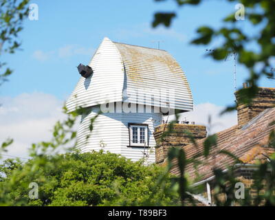 Sheerness, Kent, UK. 12th May, 2019. National Mills Weekend is the annual festival celebrating the UK's milling heritage. Pictured is Watson's Mill (formerly the Great Mill) in Sheerness which lies close to the town centre. Since 1924 the mill stood in ruin after being demolished, until being rebuilt by Caleb Watson in 2006, with fire almost destroying the rebuild in 2008 before it was due to be finished. It's a prominent local landmark but not open to the public; the ground floor has been taken over by a local insurance company. It's a Grade II  smock mill. Credit: James Bell/Alamy Live News Stock Photo