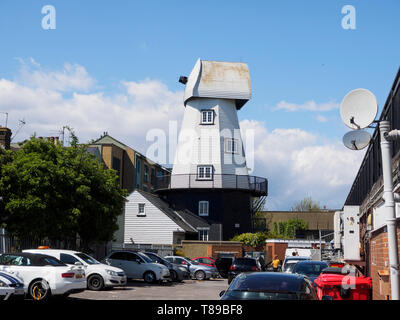 Sheerness, Kent, UK. 12th May, 2019. National Mills Weekend is the annual festival celebrating the UK's milling heritage. Pictured is Watson's Mill (formerly the Great Mill) in Sheerness which lies close to the town centre. Since 1924 the mill stood in ruin after being demolished, until being rebuilt by Caleb Watson in 2006, with fire almost destroying the rebuild in 2008 before it was due to be finished. It's a prominent local landmark but not open to the public; the ground floor has been taken over by a local insurance company. It's a Grade II  smock mill. Credit: James Bell/Alamy Live News Stock Photo