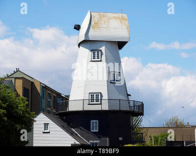 Sheerness, Kent, UK. 12th May, 2019. National Mills Weekend is the annual festival celebrating the UK's milling heritage. Pictured is Watson's Mill (formerly the Great Mill) in Sheerness which lies close to the town centre. Since 1924 the mill stood in ruin after being demolished, until being rebuilt by Caleb Watson in 2006, with fire almost destroying the rebuild in 2008 before it was due to be finished. It's a prominent local landmark but not open to the public; the ground floor has been taken over by a local insurance company. It's a Grade II  smock mill. Credit: James Bell/Alamy Live News Stock Photo