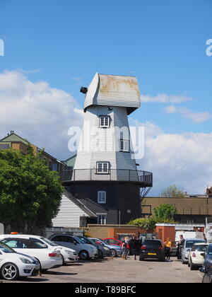 Sheerness, Kent, UK. 12th May, 2019. National Mills Weekend is the annual festival celebrating the UK's milling heritage. Pictured is Watson's Mill (formerly the Great Mill) in Sheerness which lies close to the town centre. Since 1924 the mill stood in ruin after being demolished, until being rebuilt by Caleb Watson in 2006, with fire almost destroying the rebuild in 2008 before it was due to be finished. It's a prominent local landmark but not open to the public; the ground floor has been taken over by a local insurance company. It's a Grade II  smock mill. Credit: James Bell/Alamy Live News Stock Photo