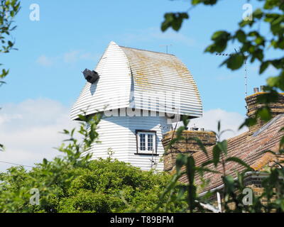 Sheerness, Kent, UK. 12th May, 2019. National Mills Weekend is the annual festival celebrating the UK's milling heritage. Pictured is Watson's Mill (formerly the Great Mill) in Sheerness which lies close to the town centre. Since 1924 the mill stood in ruin after being demolished, until being rebuilt by Caleb Watson in 2006, with fire almost destroying the rebuild in 2008 before it was due to be finished. It's a prominent local landmark but not open to the public; the ground floor has been taken over by a local insurance company. It's a Grade II  smock mill. Credit: James Bell/Alamy Live News Stock Photo