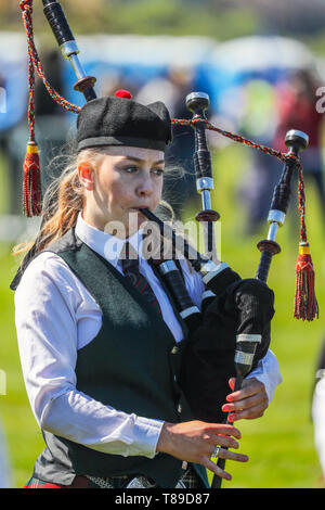 Gourock, UK 12th May 2019. The Highland Games season begins with the Gourock Highland Games at Battery Park, Gourock and features Pipe Band competitions, traditional Scottish Heavy athletics such as throwing the 16 pound weight and highland dancing with competitors as young as 5 years. This year there was an international list of competitors from countries including Poland and America Credit: Findlay/Alamy Live News Stock Photo