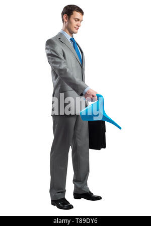 Businessman wears grey suit with suitcase Stock Photo