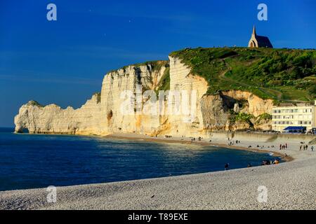 France, Seine Maritime, Pays de Caux, Alabaster coast, From the beach of Etretat, view on the cliff of Amont and the chapel Notre Dame de la Garde at dusk Stock Photo