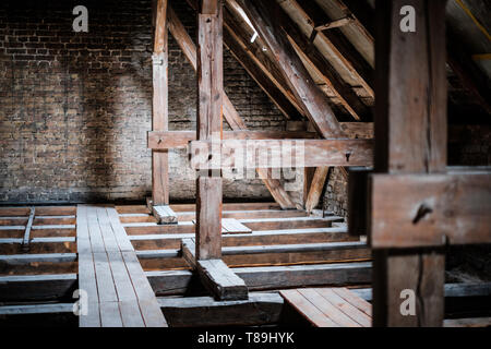 roof beams in old, empty attic / loft before renovation / construction concept - Stock Photo