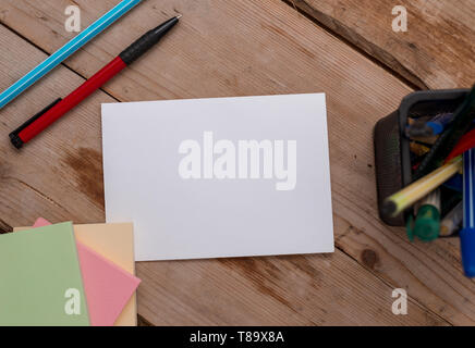Note papers and stationary placed sideways on top of softhued backdrop Business Empty template for Layout for invitation greeting card promotion poste Stock Photo