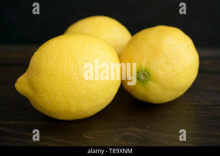 Lemons on a Dark Wood Background Stock Photo
