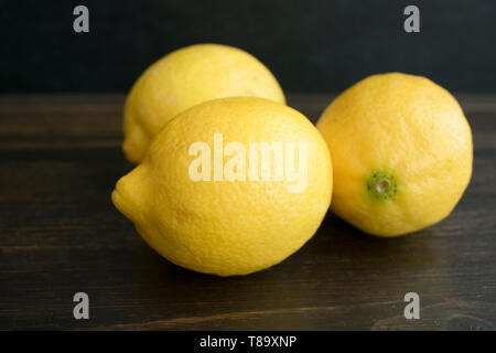 Lemons on a Dark Wood Background Stock Photo