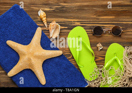Composition with beach items on wooden background Stock Photo