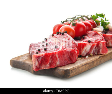 Fresh raw meat with spices and tomatoes on white background Stock Photo
