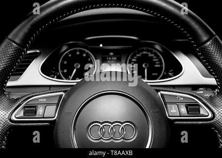 Sankt-Petersburg, Russia, Februaru 20, 2017: Close uo of a Audi A4 S-line steering wheel. Modern car interior details. Speedometer, tachometer. Car da Stock Photo