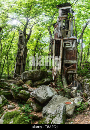 Versasca trade centre; makeshift art work made of towers in the woodland of Ticino Stock Photo