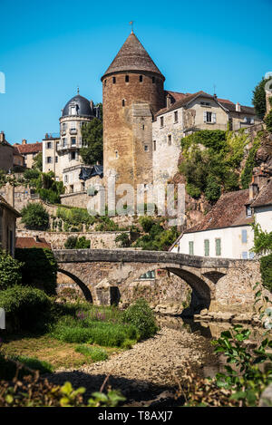 View from the docks of the vaulted bridge and the old medieval town of Semur en Auxois in France Stock Photo