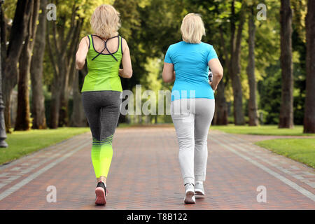 Premium Photo  Mature woman doing exercise in park.sports and