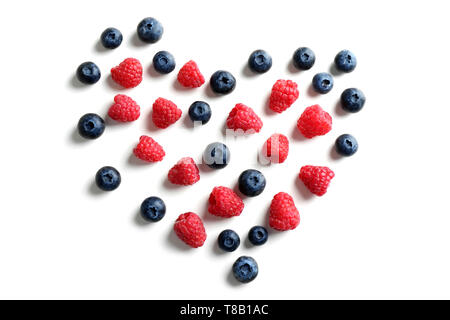 Heart made of delicious ripe berries on white background Stock Photo