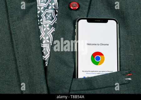 Sankt-Petersburg, Russia, August 24, 2018: Google Chrome application icon on Apple iPhone X screen close-up in jacket pocket. Google Chrome app icon.  Stock Photo