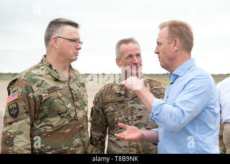 U.S. Acting Secretary of Defense Patrick M. Shanahan speaks with the Commander of U.S. Northern Command, Air Force Gen. Terrence O'Shaughnessy and the Assistant to the Chairman of the Joint Chiefs of Staff Army Maj. Gen. Ricky Waddell before departing McAllen, Texas, May 11, 2019. (DoD photo by U.S. Army Sgt. Amber I. Smith) Stock Photo