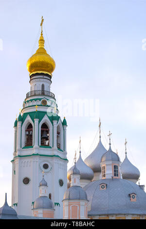 The bell tower of St. Sophia Cathedral and the dome of the Resurrection Cathedral against the background of the evening sky. Vologda