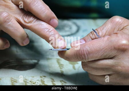 Closeup of a woman cutting nails, health care concept Stock Photo