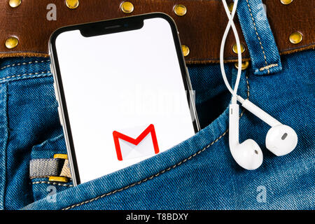 Sankt-Petersburg, Russia, April 14, 2018: Google Gmail application icon on Apple iPhone X smartphone screen in jeans pocket. Gmail app icon. Gmail is  Stock Photo