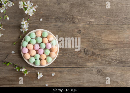 Mini Mochi - traditional japanese dessert on wooden background, top view, copy space. Stock Photo
