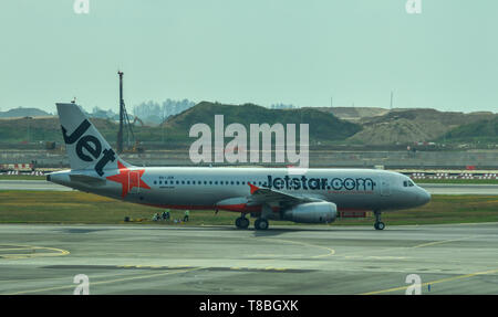 Singapore - Mar 28, 2019. 9V-JSK Jetstar Asia Airbus A320 taxiing on runway of Singapore Changi Airport (SIN). Stock Photo