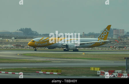Singapore - Mar 28, 2019.  9V-OJD Boeing 787-9 Dreamliner Scoot taxiing on runway of Singapore Changi Airport (SIN). Stock Photo